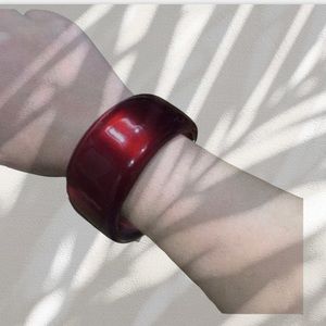 Red bangle with gold inner accent